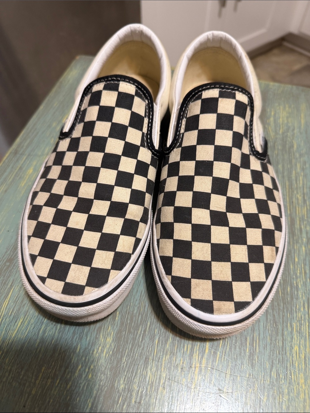 Vans Black and White Checkerboard Slip-On Sneakers